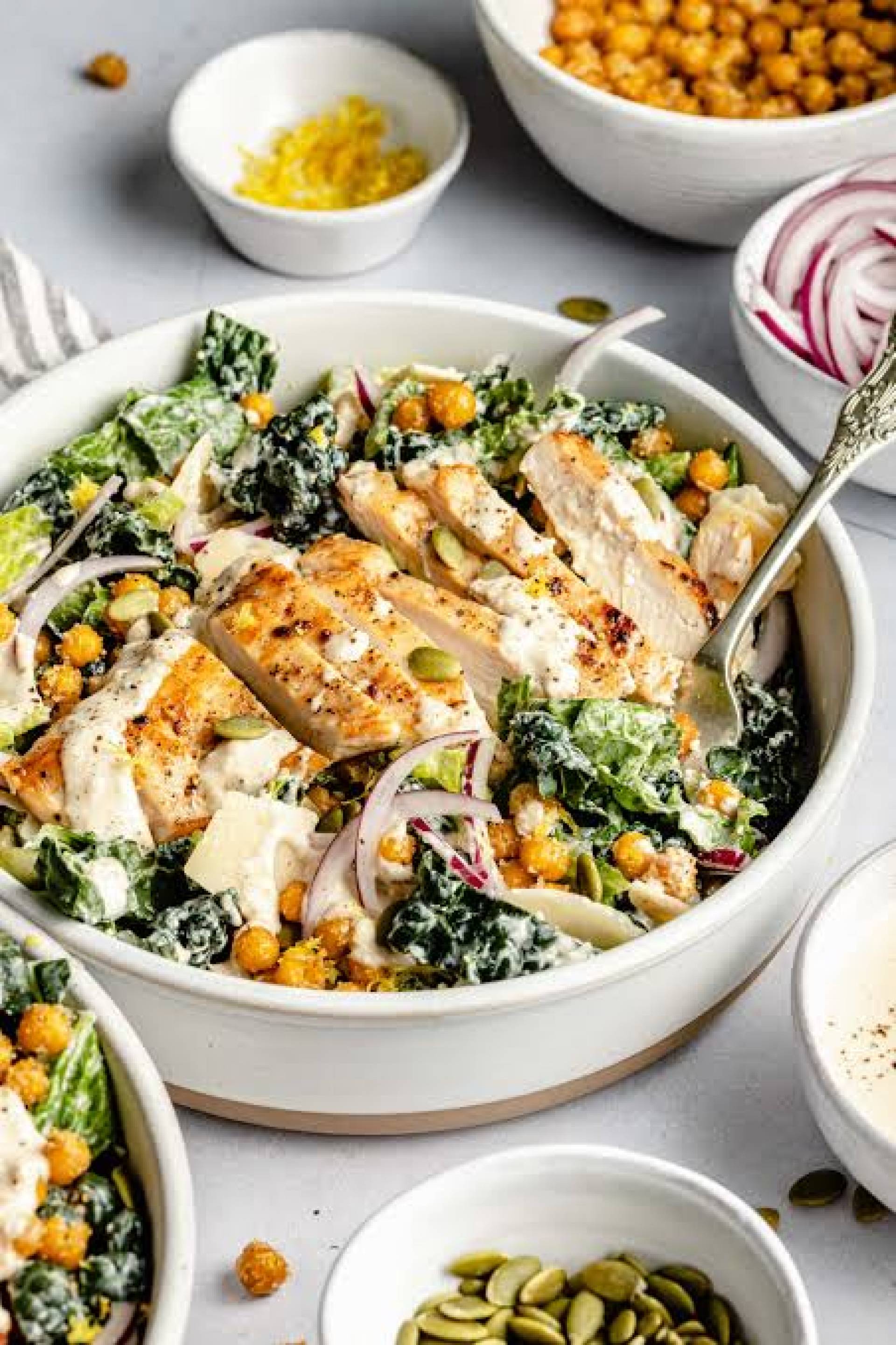 GF DF Grilled Chicken Kale Caesar Salad with Red Onion and Roasted Corn, Herby Garlic Bread
